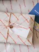 Magnificent Stanley Gift wrapped in logo tissue and twine with a hand stamped name tag