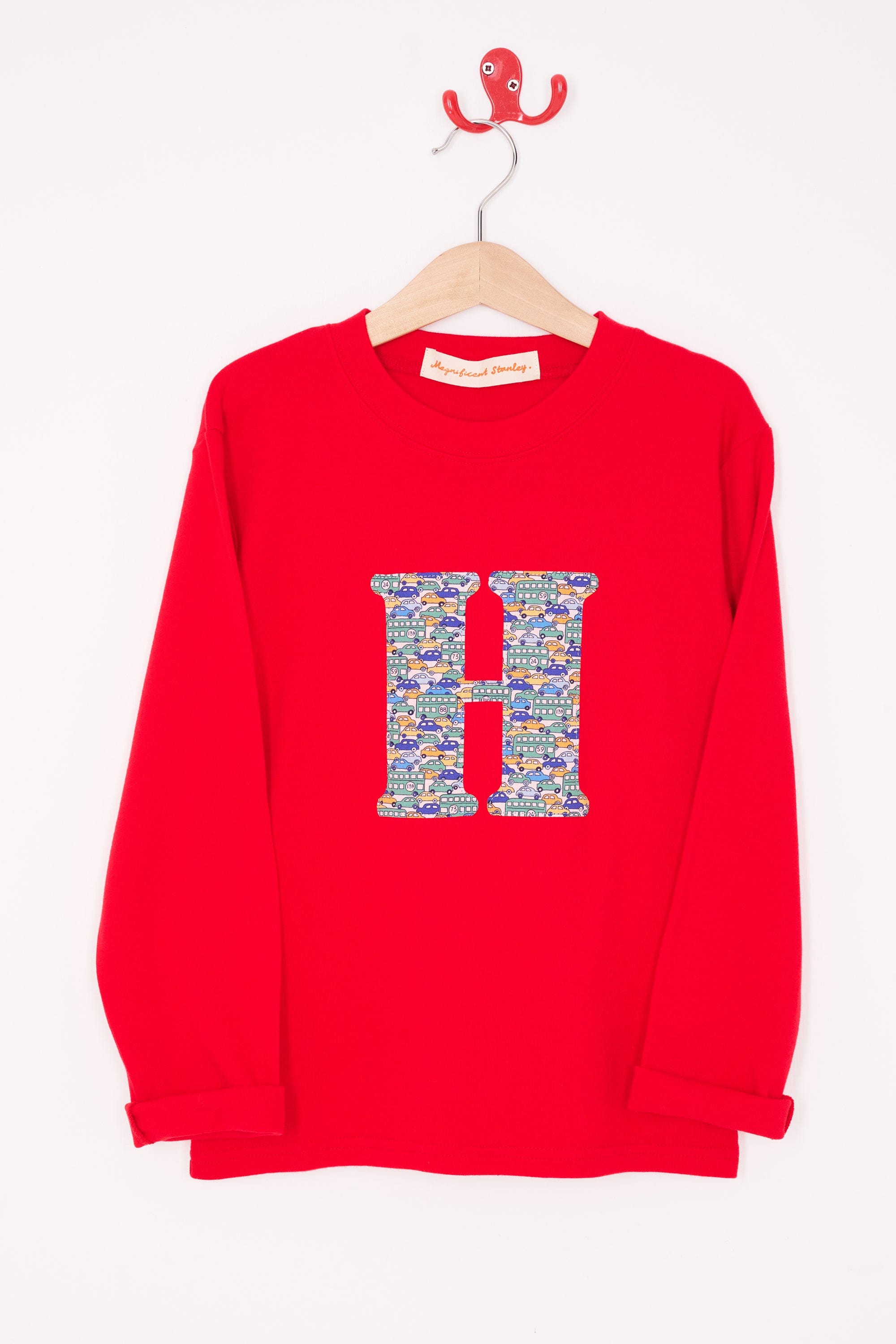 A personalised red t-shirt with an initial made from a liberty vintage cars print on the front.